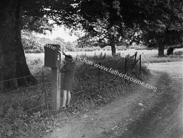 GIRL AT LETTERBOX